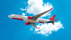Modern Air India Boeing aircraft in flight against bright blue sky with white clouds, capturing the airline's distinctive livery and contemporary aircraft design