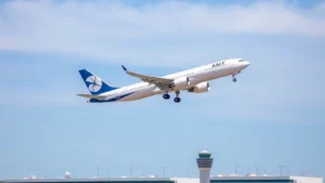 Modern commercial airplane taking off from Dallas Fort Worth International Airport on a clear sunny day, showing the aircraft against blue sky with airport infrastructure visible below