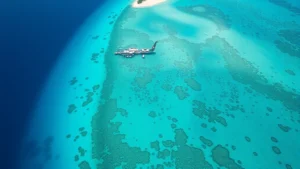 Aerial view of turquoise lagoons and white sandy beaches in Mauritius with crystal clear water and coral reefs visible from above, tropical island paradise landscape